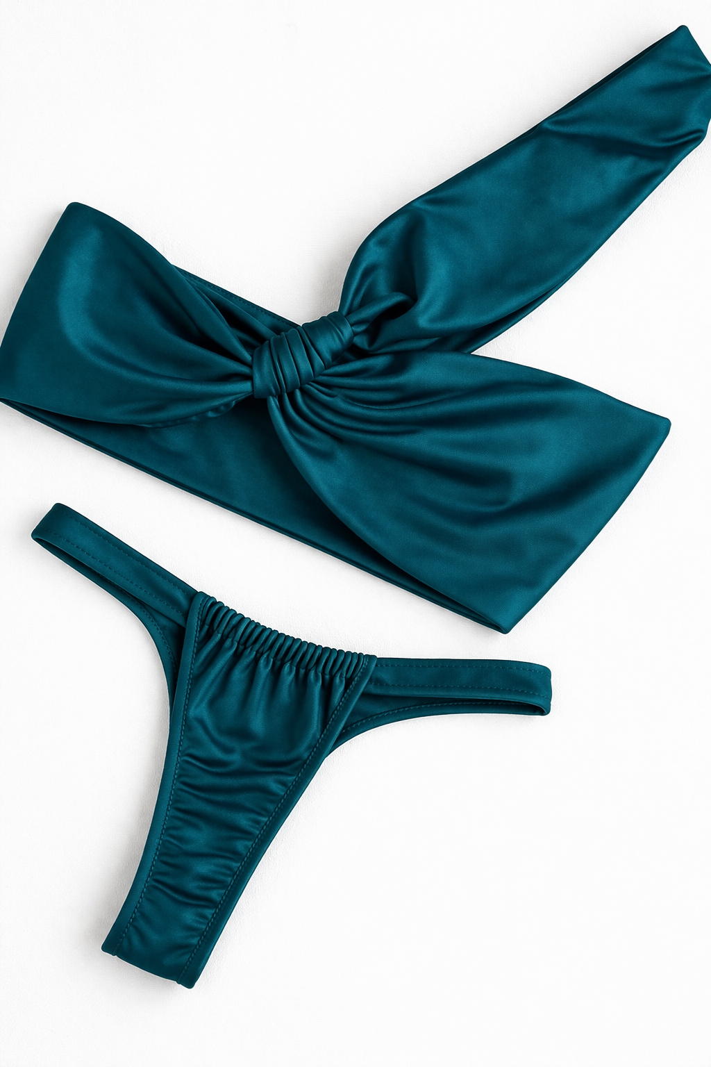 Teal bikini set with a large bow on a white background